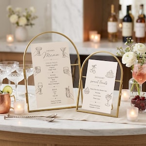 May include: Two arched gold metal frames holding printed menus on cream cardstock. The larger menu lists drinks, cocktails, wine, and beer with line art illustrations. The smaller menu lists dessert and sweet treats with line art illustrations.