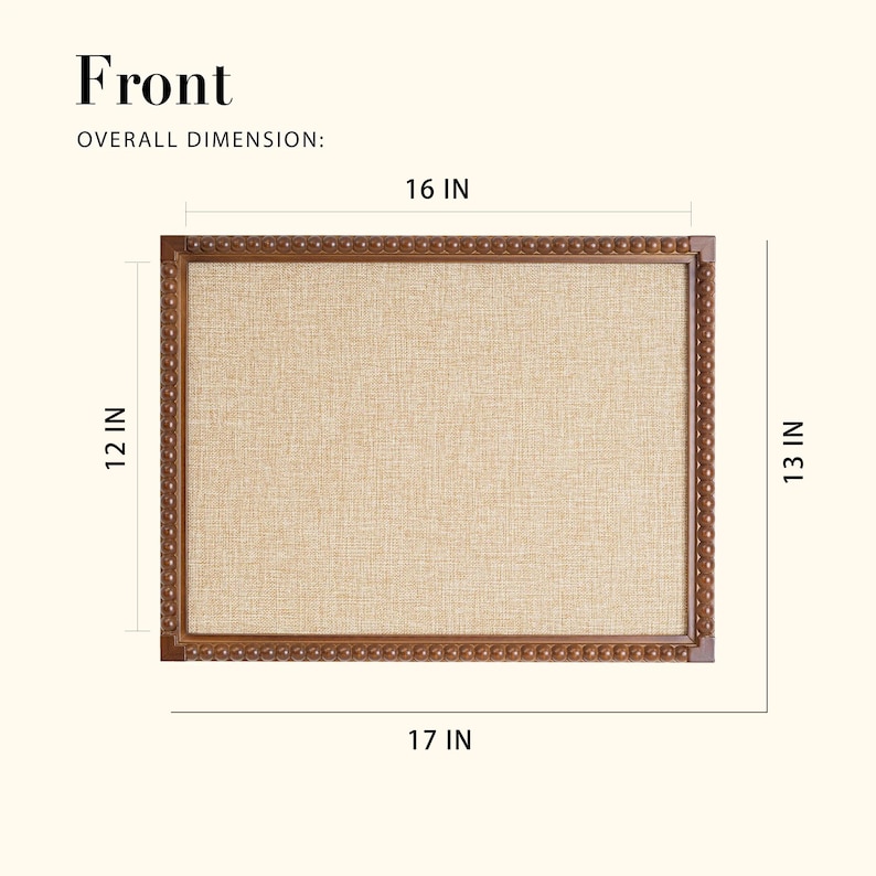 May include: A rectangular noticeboard with a light tan fabric surface and a decorative brown wooden frame. The overall dimensions are 43 cm wide, 33 cm high, and 41 cm across. The frame has a detailed, textured design.