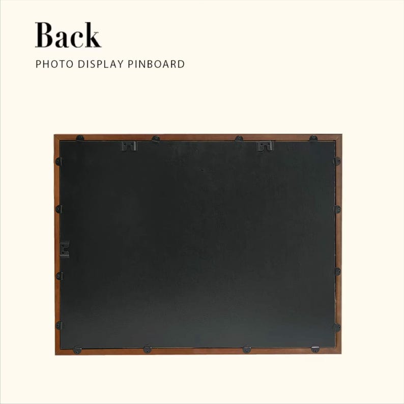 May include: The reverse side of a rectangular photo display pinboard with a dark brown wooden frame. The pinboard features a black backing and metal clips for hanging. The text "Back" and "PHOTO DISPLAY PINBOARD" are at the top.