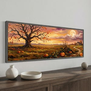 May include: A panoramic framed wall art print featuring a large, bare-branched tree in a field filled with orange pumpkins under a sunset sky. A full moon hangs in the clouds above a small house, with a winding path leading through the landscape.