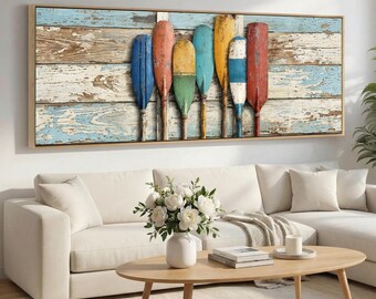 May include: A rectangular wall art print featuring seven vertical wooden boat oars in blue, orange, yellow, green, and red, arranged against a background of weathered, distressed horizontal wooden planks with peeling paint in shades of blue and white.