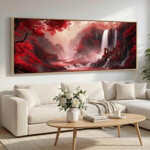 Könnte beinhalten: Ein rechteckiger Wandkunstdruck, der eine Landschaft mit leuchtend roten Bäumen, einem Wasserfall und einem gewundenen Fluss zeigt. Die Szene umfasst felsige Klippen und architektonische Ruinen inmitten des Laubs in Rot- und Weißtönen.