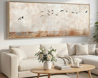 May include: A large, horizontal rectangular wall art piece featuring an abstract, textured background in shades of beige, cream, and light brown. The painting depicts a flock of small, dark birds in flight across the upper portion of the canvas.