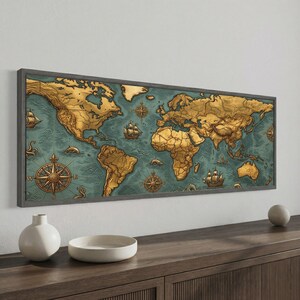 May include: A rectangular framed wall art piece featuring a vintage-style world map with golden-toned continents set against a textured teal ocean background. The map includes illustrations of sailing ships, sea creatures, and compass roses.