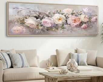 Op de afbeelding: Een rechthoekig, ingelijst bloemenschilderij met een cluster van rozen in tinten wit en roze. Het kunstwerk heeft een zacht, gedempt kleurenpalet met een lichtgrijze achtergrond. Het schilderij wordt boven een beige bank weergegeven.