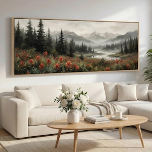 Könnte beinhalten: Ein rechteckiges Landschaftsgemälde in einem Holzrahmen. Das Kunstwerk zeigt eine Berglandschaft mit einem Fluss, immergrünen Bäumen und roten Wildblumen. Das Gemälde hat eine gedämpfte Farbpalette.