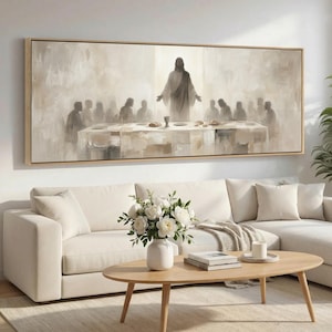 May include: A large, rectangular framed canvas art piece depicting a religious scene with a central figure and a group of people gathered around a table. The artwork is rendered in muted tones of beige and gray, creating a serene and contemplative atmosphere.