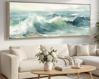 May include: A panoramic rectangular wall art piece featuring a watercolor painting of ocean waves in shades of teal, turquoise, and white. The artwork is enclosed in a thin, light-colored wooden frame and depicts a dynamic seascape with cresting waves.