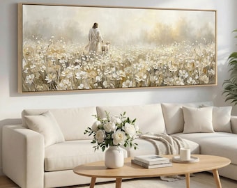 May include: A large rectangular framed painting depicts a figure in white robes with a lamb in a field of white flowers. The artwork has a soft, muted color palette with a warm, golden light. The painting is displayed above a white sectional sofa.