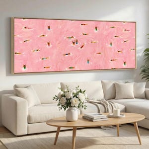 May include: A rectangular wall art print featuring a vibrant pink textured background filled with numerous small, stylized figures of people swimming in various poses, wearing colorful swimsuits, and floating across the entire surface.