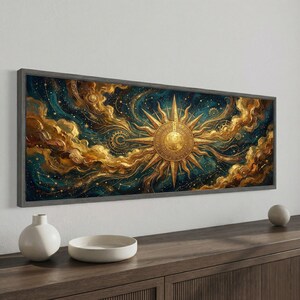 May include: A framed artwork featuring a celestial design. The artwork showcases a golden sunburst against a backdrop of swirling clouds and a starry night sky in shades of teal and gold. The artwork is displayed on a wooden cabinet.