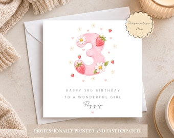 May include: A square white birthday card featuring a large pink number three decorated with watercolor strawberries, daisies, and small hearts. The text reads: HAPPY 3RD BIRTHDAY TO A WONDERFUL GIRL Poppy. A scalloped label says: Personalise Me.