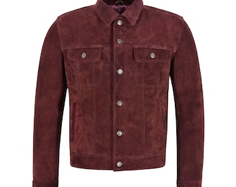 May include: A burgundy suede jacket with a classic button-up design. The jacket features two chest pockets and a collared neckline. The buttons and pocket details are silver. The jacket is a medium weight and is suitable for cooler weather.