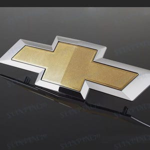 Insignia con emblema de corbatín para parrilla delantera n.° 22786809 para Chevy Silverado 1500 (2014-2015): logotipo de repuesto OEM para camioneta GM Chevrolet.