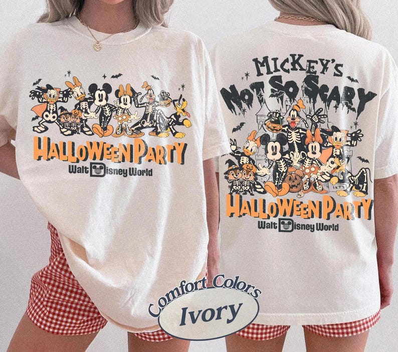 May include: An ivory t-shirt featuring a graphic print of Disney characters in skeleton costumes. The front shows the characters with the text "HALLOWEEN PARTY" and "Walt Disney World". The back displays a larger version of the same graphic.