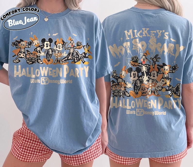 May include: A blue short-sleeve t-shirt featuring a graphic of Disney characters in skeleton costumes. The text reads Mickey's Not So Scary Halloween Party Walt Disney World. The design includes Mickey, Minnie, Donald, Daisy, Goofy, Pluto, and Chip 'n Dale.