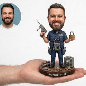 May include: A bobblehead figurine of a locksmith holding a gun and a padlock. The figure wears a blue uniform and has a set of keys hanging from his neck. A small safe and other locksmith tools are on the base. The base reads "Locksmith - 12".