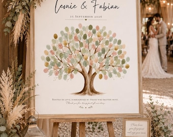 May include: A square wedding guest book sign on a wooden easel featuring a tree illustration with colorful fingerprint leaves, the names Leonie & Fabian, the date 25 September 2026, and the text Rooted in love, surrounded by those who matter most.