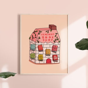 May include: A pink and white illustration of a house with the words "Feminist Book Shop" above the door. The house is decorated with green vines and has books with titles like "I Know Why The Caged Bird Sings" and "The Second Sex" displayed in the windows.