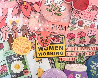 May include: A collection of assorted vinyl stickers featuring various illustrations including a pink milk carton, a yellow sun with text, a uterus graphic with flowers, a jar of blueberry jam, and a stop sign with social justice text.