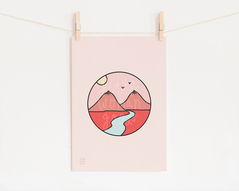 May include: A pink printable art print with a circle design featuring two red mountains, a blue river, a yellow sun, and three birds flying in the sky. The text "Little Wanderings" is at the bottom of the print.
