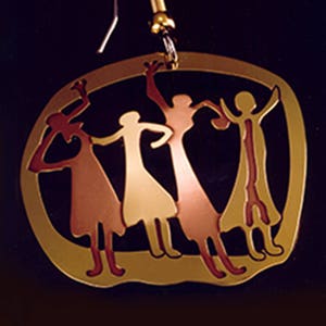 May include: Gold-toned metal earring with a design of four stylized figures in shades of red, gold, and brown. The figures are holding hands and dancing in a circle.