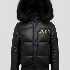May include: Black puffer jacket with a faux fur hood. The jacket features the word "POLO" in gold lettering on the chest. It has a ribbed hem and cuffs. A stylish winter coat.