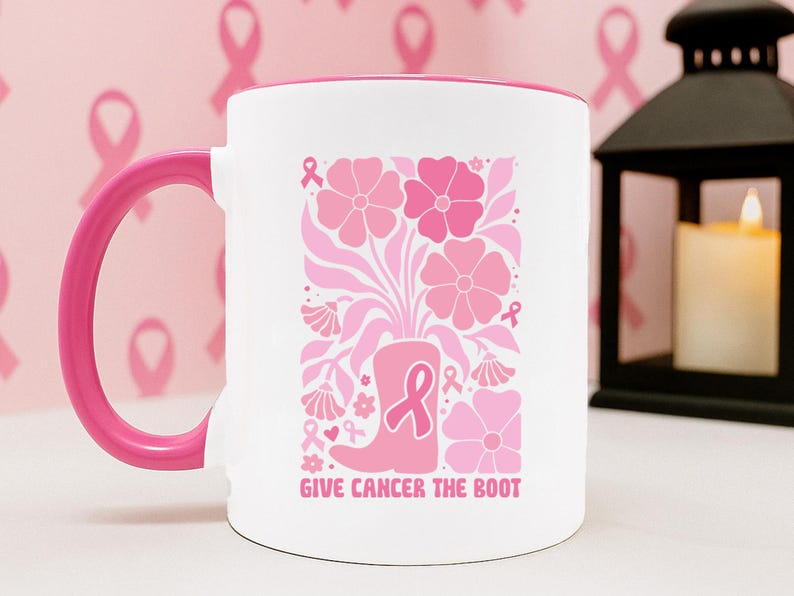 May include: A white ceramic mug with a black handle and the text "But First, Coffee" in a bold, black font. The mug is filled with a dark liquid, likely coffee, and sits on a light-colored surface.