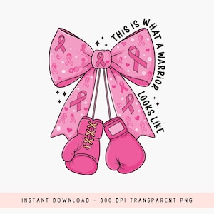 May include: Pink bow with pink ribbons and hearts, with pink boxing gloves hanging below. The text "THIS IS WHAT A WARRIOR LOOKS LIKE" is written in black around the bow. A design for breast cancer awareness.