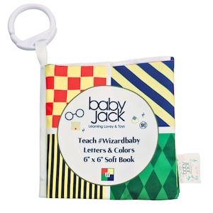 May include: A yellow, red, blue, and green soft book with a checkered, striped, and diamond pattern. The book has a white loop handle and says "baby Jack Learning Lovey & Toys" and "Teach #Wizardbaby Letters & Colors 6" x 6" Soft Book".
