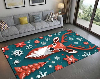 May include: A rectangular teal rug featuring a stylized reindeer head with red antlers and a white chest. The rug is decorated with red and white snowflakes and a Christmas tree design. The rug is approximately 60 inches long.
