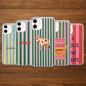 May include: A collection of five phone cases with various designs. The cases feature vertical stripes in pink, green, and blue, and include images of a cow, sardines, and text that reads "la dolce v", "CIAO, AMO", and "IL DOLCE FAR ENTE".