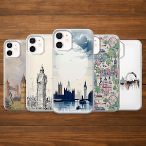 May include: Five phone cases with London-themed designs. The cases feature illustrations of Big Ben, the London Eye, and other landmarks. The cases are in clear protective covers, set against a wooden background.
