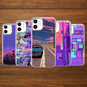 May include: Five phone cases with colorful designs. One case features a blue car on a desert road, another has a cityscape, and a third displays an arcade game. The cases are on a wooden surface.