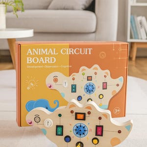May include: A wooden animal circuit board toy featuring a dinosaur shape, with various colored buttons, switches, and dials. The box displays the text "ANIMAL CIRCUIT BOARD" and the words "Development, Observation, Cognitive". Suitable for children aged 3 and over.