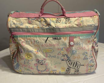 Bolso cambiador vintage de los 90 estilo baby boom con animales del zoológico, dibujos en rosa y azul, para mamá y papá.