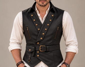 May include: A black leather vest featuring a double-breasted front with gold-toned buttons, two vertical zippered chest pockets, and an integrated waist belt with a gold-toned buckle and a small attached utility pouch with a snap closure.