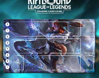 May include: A rectangular playmat for the "Riftbound League of Legends Trading Card Game." The mat features a colorful illustration of a character with a rabbit-like appearance, and designated zones for gameplay, including "Rune Deck," "Base," and "Main Deck."
