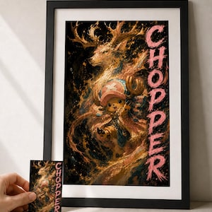 Peut inclure: Impression d'art encadrée représentant une illustration de personnage avec le mot "CHOPPER" en rose. L'œuvre représente une figure de type cerf avec un personnage portant un chapeau rose. L'impression est dans un cadre noir.