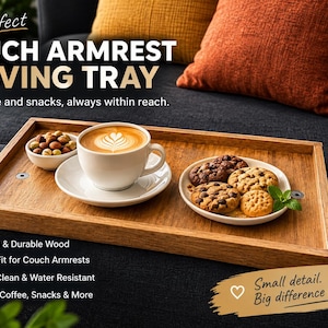 May include: A rectangular wooden couch armrest serving tray featuring a flat surface with two small circular metal accents. The tray holds a white ceramic cup of coffee on a saucer, a small bowl of nuts, and a plate with four chocolate chip cookies.