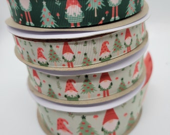 May include: Four spools of green and white ribbon with a Christmas gnome and tree pattern.