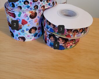 May include: Four rolls of colorful ribbon with a cartoon character design. The ribbon is white with a variety of colors and designs. The ribbon is 2.5 inches wide.