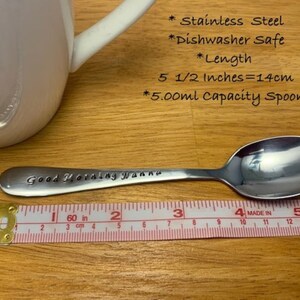 May include: A stainless steel spoon with the text "Good Morning Wanna" engraved on the handle. The spoon is 5 1/2 inches long and has a 5.00 ml capacity. It is dishwasher safe.