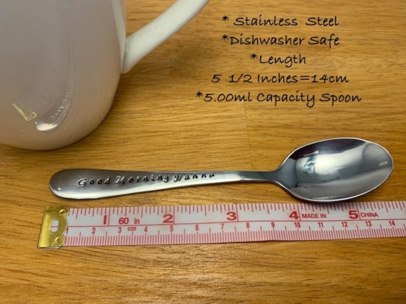 May include: A stainless steel spoon with the text "Good Morning Wanna" engraved on the handle. The spoon is 5 1/2 inches long and has a 5.00 ml capacity. It is dishwasher safe.