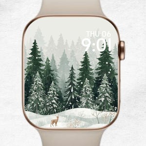 May include: A cream-colored smartwatch with a forest scene on the screen. The screen displays a winter landscape with evergreen trees, snow, and a deer. The time is displayed as 9:01 on Thursday.