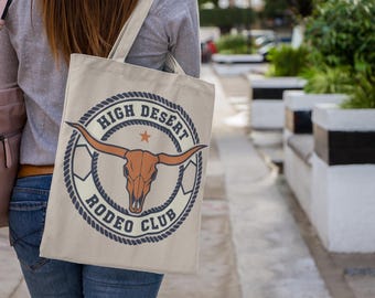 Bolso de mano con el escudo del club de rodeo / insignia tipográfica del oeste, lona rústica universitaria