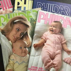 May include: Four vintage knitting pattern books with the title "PHILDAR" on the cover. The books feature babies on the cover. One book is pink, one is yellow, one is blue, and one is green.