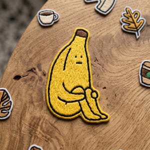 Sad Banana Embroidered Patch, Funny Sitting Fruit Iron On Badge, Sarcastic Food Applique, 2D Flat Accessory for Jackets, Gift for Her