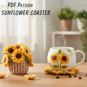 May include: A PDF pattern for a sunflower coaster. The image shows a crocheted sunflower coaster under a white mug with sunflower designs. A crocheted basket with sunflower flowers is also present. The text "SUNFLOWER COASTER" is visible.