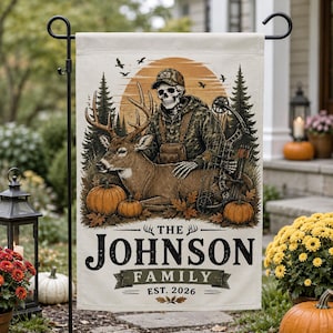 May include: A rectangular garden flag featuring a graphic of a skeleton hunter in camouflage clothing with a compound bow, positioned behind a deer. The scene includes pine trees, pumpkins, and the text THE JOHNSON FAMILY EST. 2026.